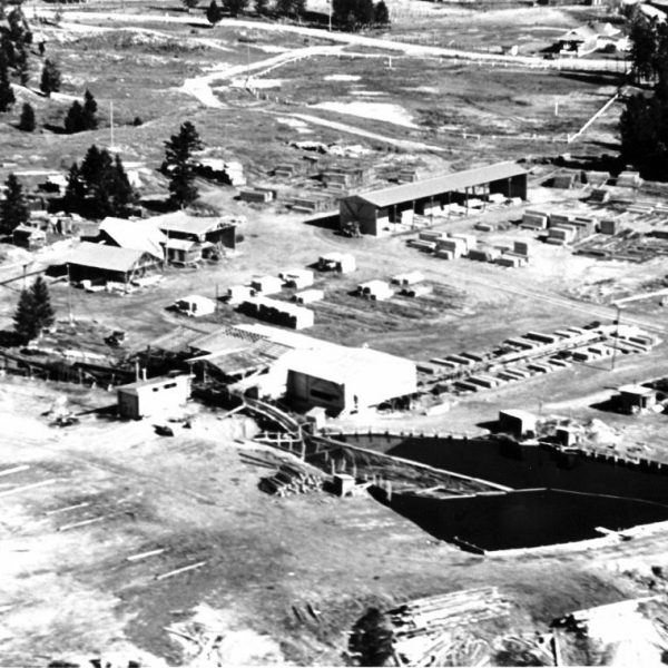 The Drott cleaning up the heavy machinery of the shut-down sawmill operation